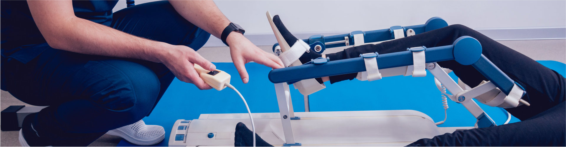 man performing foot rehabilitation for the patient